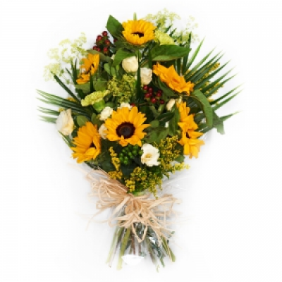 Funeral Flowers In Cellophane - A fresh funeral bouquet in yellows - including sunflowers or gerberas.