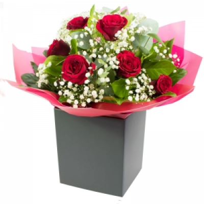 Perfect Match - You guessed it. Not 5, but 6 fabulous red roses beautifully presented and delivered by a local florist. 
