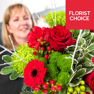 Christmas Florist Choice Flowers - Let the experts create a unique bouquet using the freshest festive beautiful blooms of the day, made especially for your loved one.